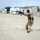 A Somali government soldier fires at Islamist fighters in Mogadishu on Jul. 11, 2009.